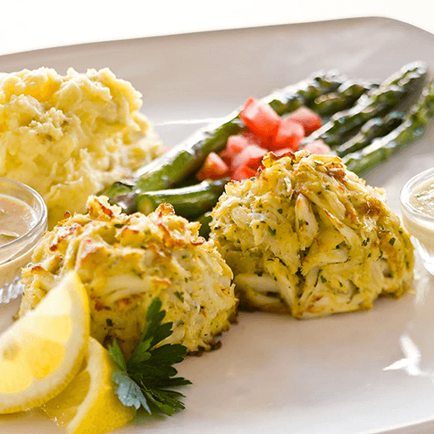 Get our famous Jumbo Lump Crab Cakes served with two sides.